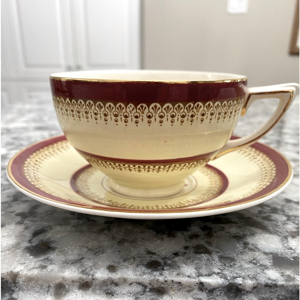 CROWN DUCAL BURGUNDY AND CREAM WITH GOLD TRIM AND A ROSE IN CUP AND ON SAUCER